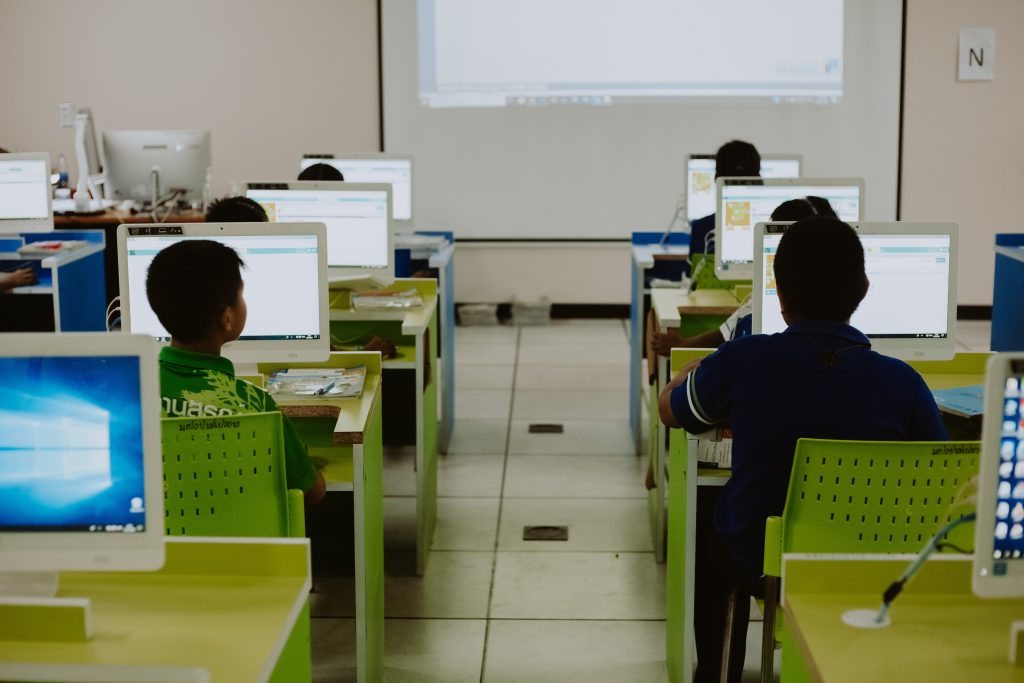 Students on computers in a classroom.