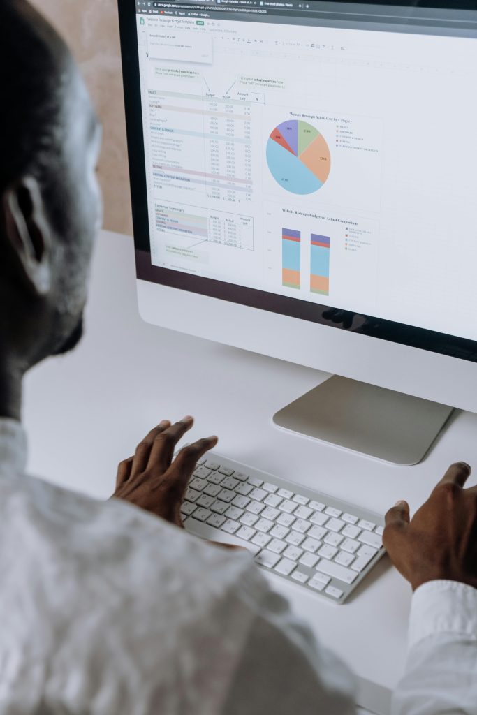 A person on a computer working with data