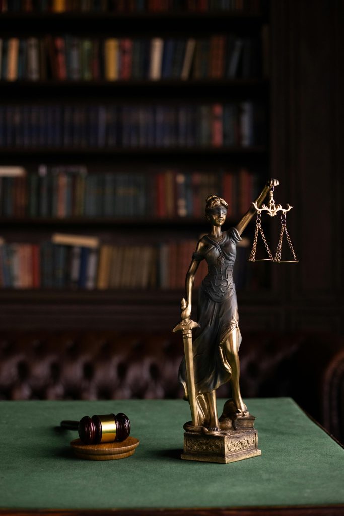 A statue of justice and a gavel