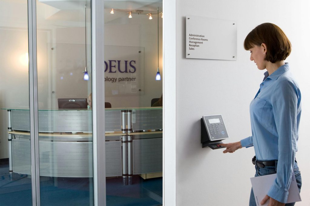 A person using a biometric access control system