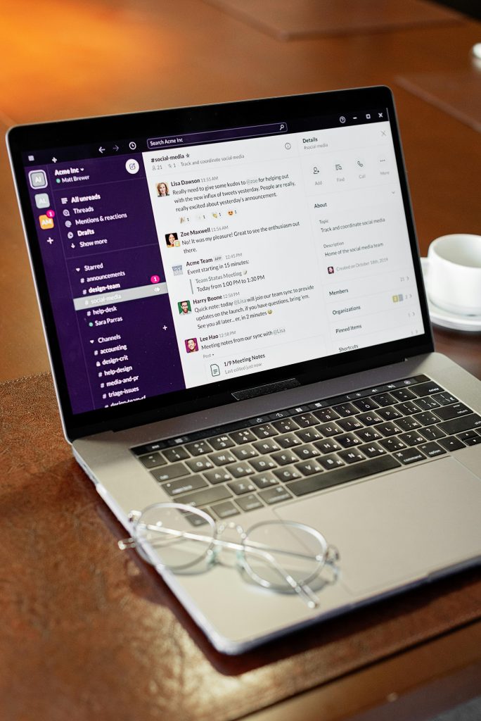 Image of a laptop on a brown wooden table